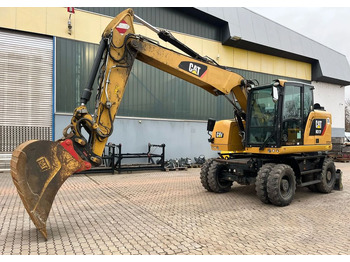 Колісний екскаватор CATERPILLAR