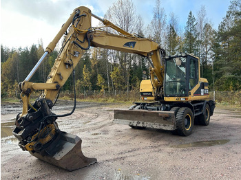 Колісний екскаватор CATERPILLAR M312