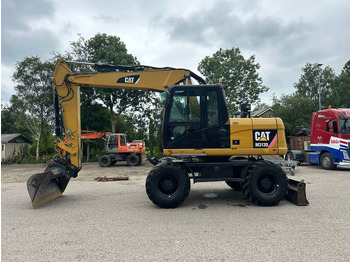 Колісний екскаватор CATERPILLAR M313D