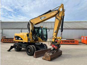 Колісний екскаватор CATERPILLAR M318D