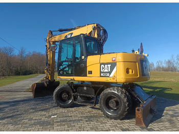 Колісний екскаватор CATERPILLAR M313D