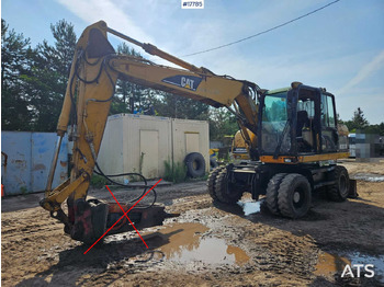 Колісний екскаватор CATERPILLAR M313C