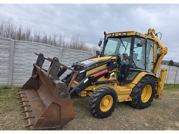 Екскаватор-навантажувач CATERPILLAR