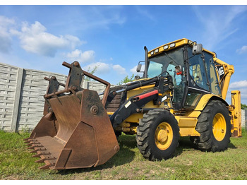 Екскаватор-навантажувач CATERPILLAR