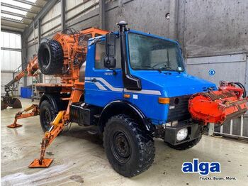 Вантажівка з маніпулятором UNIMOG U1450