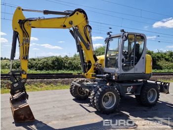 Колісний екскаватор WACKER