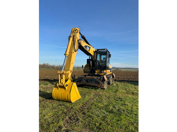 Колісний екскаватор CATERPILLAR M322D