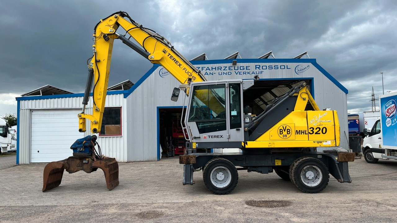 Fuchs TeRex MHL 320 D Umschlagbagger Greifer Pratzen - Перевантажувач: фото 1 Fuchs TeRex MHL 320 D Umschlagbagger Greifer Pratzen - Перевантажувач: фото 1