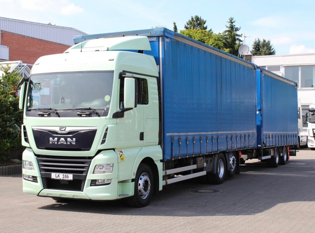 MAN TGX 26.460 Retarder Jumbo-Zug 120M3 Durchlade - Тентована вантажівка: фото 1 MAN TGX 26.460 Retarder Jumbo-Zug 120M3 Durchlade - Тентована вантажівка: фото 1