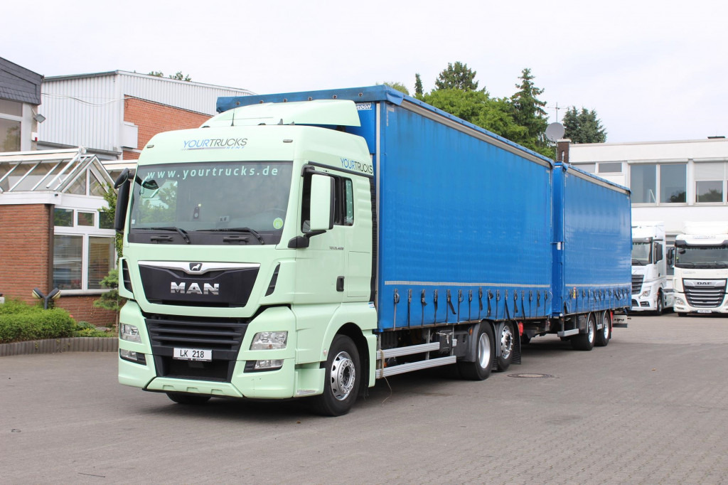 MAN TGX 26.460 Retarder Jumbo-Zug 120M3 Durchlade - Тентована вантажівка: фото 1 MAN TGX 26.460 Retarder Jumbo-Zug 120M3 Durchlade - Тентована вантажівка: фото 1