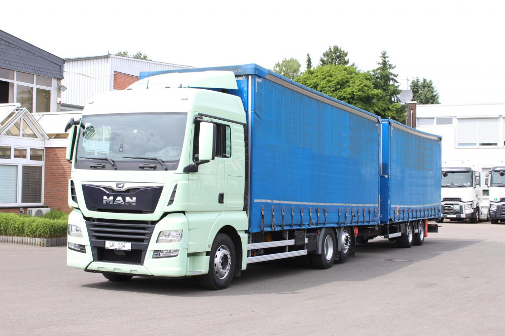 MAN TGX26.460 Durchlad Plane-Jumbo Retarder Hubdach - Тентована вантажівка: фото 1 MAN TGX26.460 Durchlad Plane-Jumbo Retarder Hubdach - Тентована вантажівка: фото 1