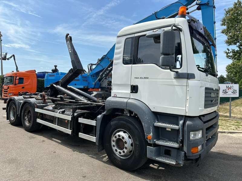 MAN TGA 33.360 6x4 HOOKLIFT - MANUAL ZF - BIG AXLES HUB REDUCTION / STEEL SPRING - BE TRUCK - Гаковий мультиліфт вантажівка: фото 1 MAN TGA 33.360 6x4 HOOKLIFT - MANUAL ZF - BIG AXLES HUB REDUCTION / STEEL SPRING - BE TRUCK - Гаковий мультиліфт вантажівка: фото 1