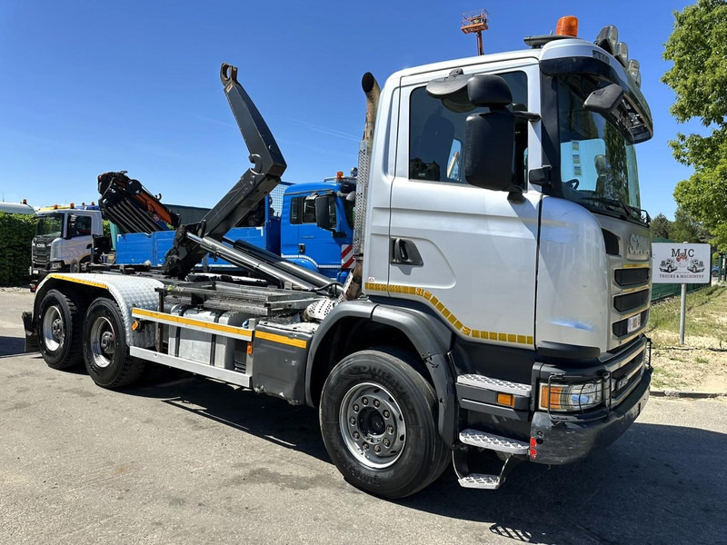 Scania G450 6x4 HOOKLIFT AJK 20T - 5760mm - 3m90 WB - HUB REDUCTION / STEEL SUSP. - EURO 6 - BE TRUCK - Гаковий мультиліфт вантажівка: фото 1 Scania G450 6x4 HOOKLIFT AJK 20T - 5760mm - 3m90 WB - HUB REDUCTION / STEEL SUSP. - EURO 6 - BE TRUCK - Гаковий мультиліфт вантажівка: фото 1
