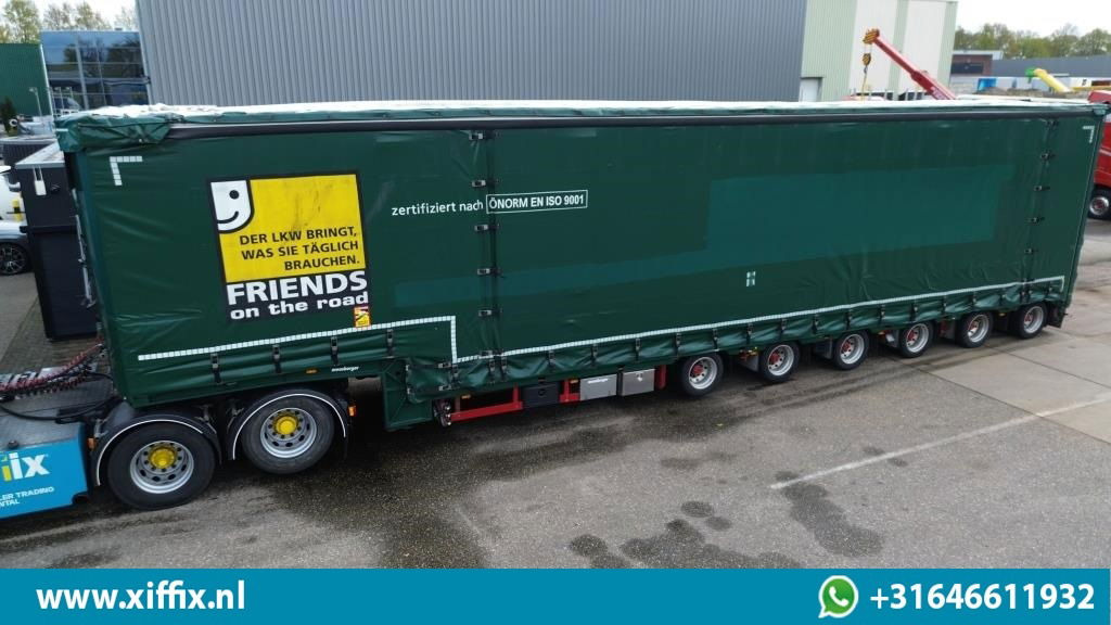 Meusburger 6-ass. Semi dieplader met elektrische huifopbouw / 3x naloop gestuurd - Низькорамна платформа напівпричіп: фото 1 Meusburger 6-ass. Semi dieplader met elektrische huifopbouw / 3x naloop gestuurd - Низькорамна платформа напівпричіп: фото 1