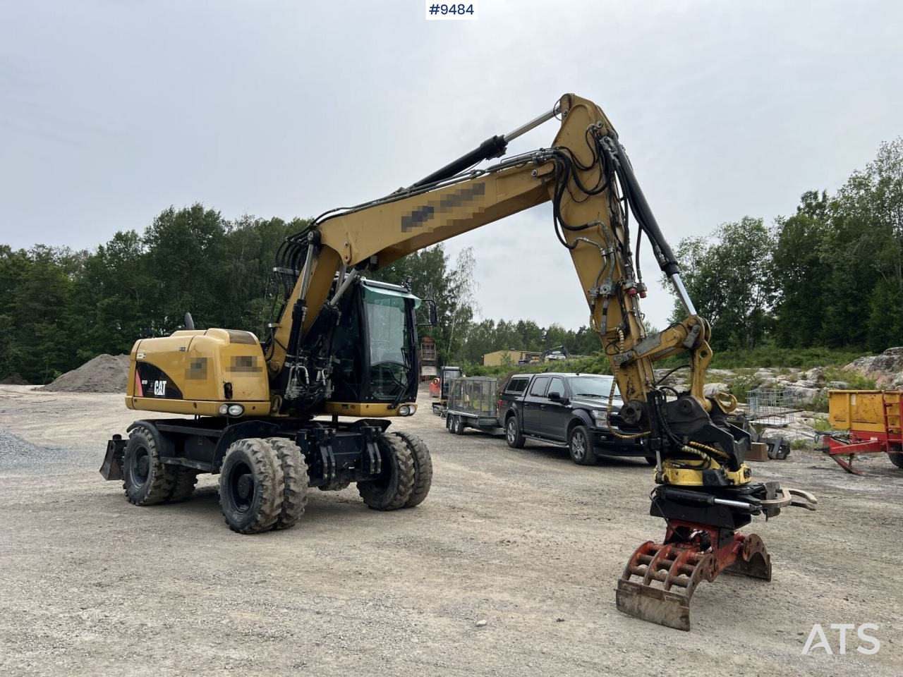 CAT M313D with tipping wagon and attachments (VIDEO) - Колісний екскаватор: фото 1 CAT M313D with tipping wagon and attachments (VIDEO) - Колісний екскаватор: фото 1