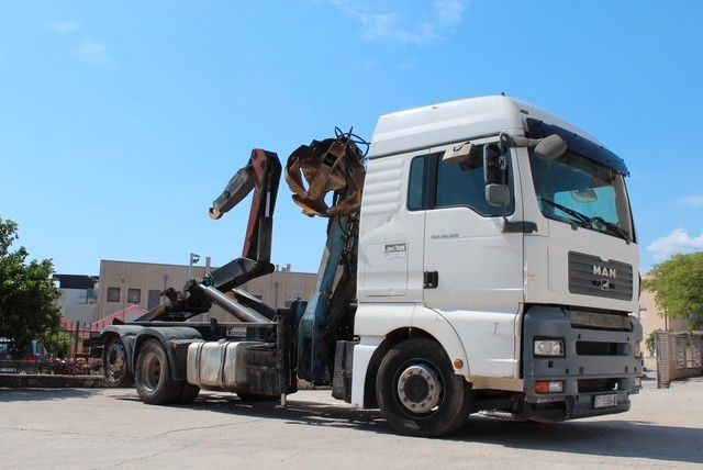 MAN TGA 26.360 FG 6x2 LL GERGEN Abroll + Penz Kran - Гаковий мультиліфт вантажівка, Вантажівка з маніпулятором: фото 1 MAN TGA 26.360 FG 6x2 LL GERGEN Abroll + Penz Kran - Гаковий мультиліфт вантажівка, Вантажівка з маніпулятором: фото 1