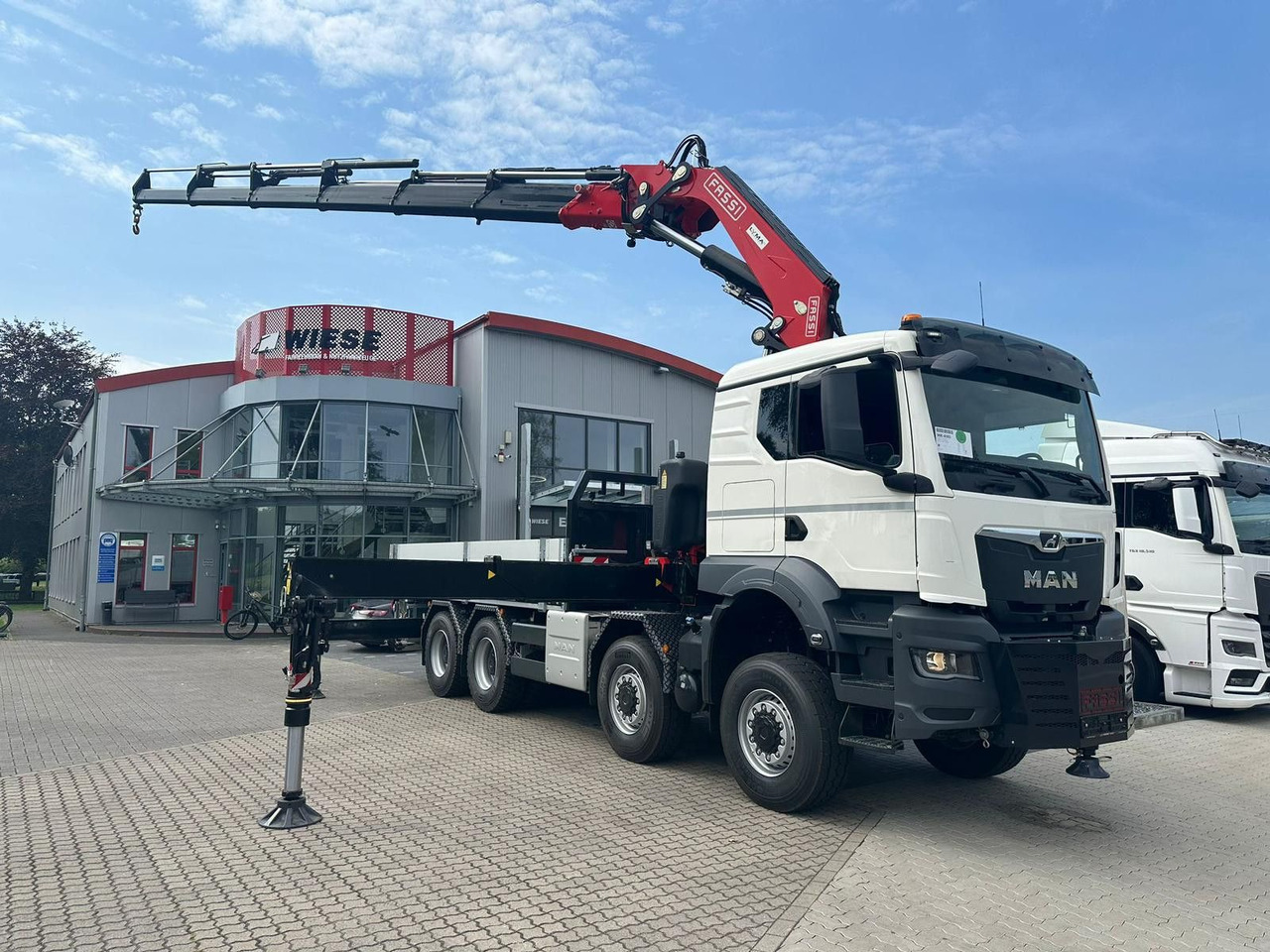 MAN TGS 41.520 8x8 mit Fassi Ladekran F710RA.2.26 - Бортова вантажівка/ Платформа: фото 1 MAN TGS 41.520 8x8 mit Fassi Ladekran F710RA.2.26 - Бортова вантажівка/ Платформа: фото 1