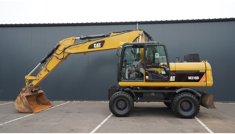 Caterpillar M318D 4X4 WHEELED EXCAVATOR - Будівельна техніка: фото 1 Caterpillar M318D 4X4 WHEELED EXCAVATOR - Будівельна техніка: фото 1