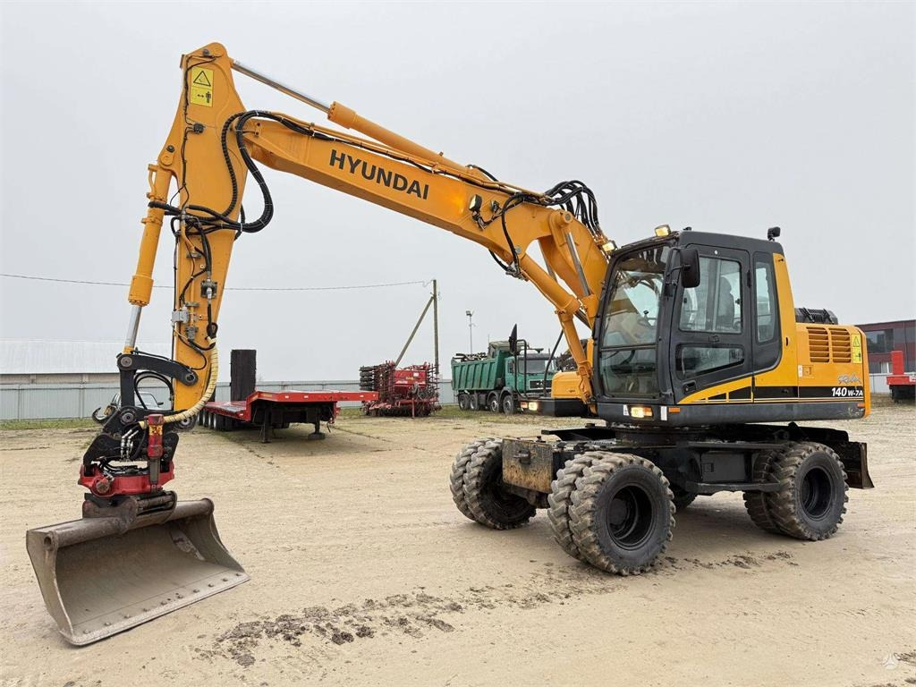 Hyundai Robex 140 W-7A ROTOTILT - Колісний екскаватор: фото 1 Hyundai Robex 140 W-7A ROTOTILT - Колісний екскаватор: фото 1