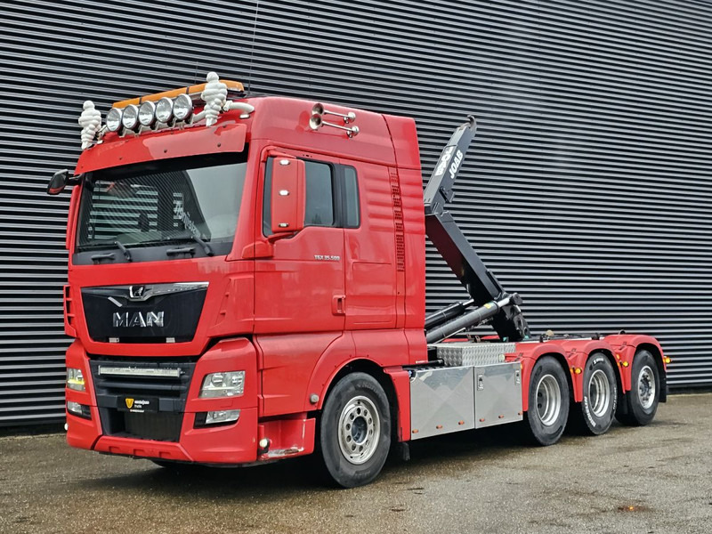 MAN TGX 35.500 / 8x4-4 / HOOKLIFT / ABROLL-KIPPER - Гаковий мультиліфт вантажівка: фото 1 MAN TGX 35.500 / 8x4-4 / HOOKLIFT / ABROLL-KIPPER - Гаковий мультиліфт вантажівка: фото 1