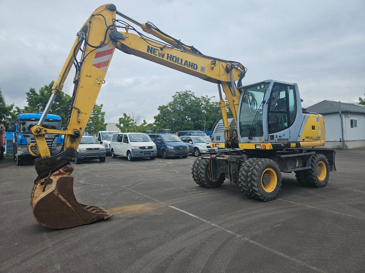 New Holland MH Plus 18t Mobilbagger - Колісний екскаватор: фото 1 New Holland MH Plus 18t Mobilbagger - Колісний екскаватор: фото 1