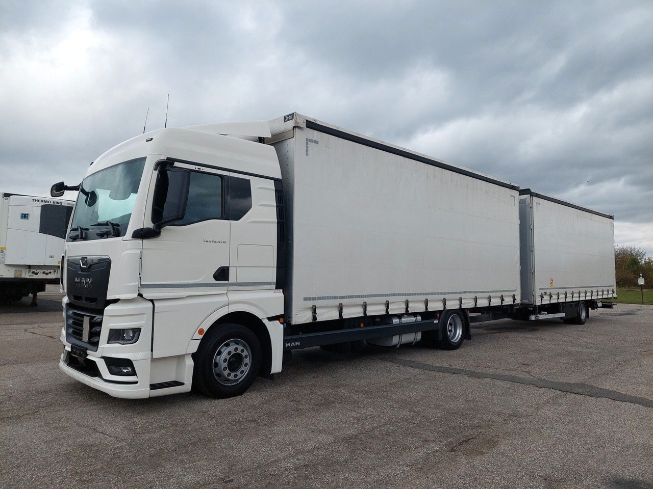 MAN TGX 18.470 LL + Gniotpol G-4080 120 m3 Durchbar - Тентована вантажівка: фото 1 MAN TGX 18.470 LL + Gniotpol G-4080 120 m3 Durchbar - Тентована вантажівка: фото 1