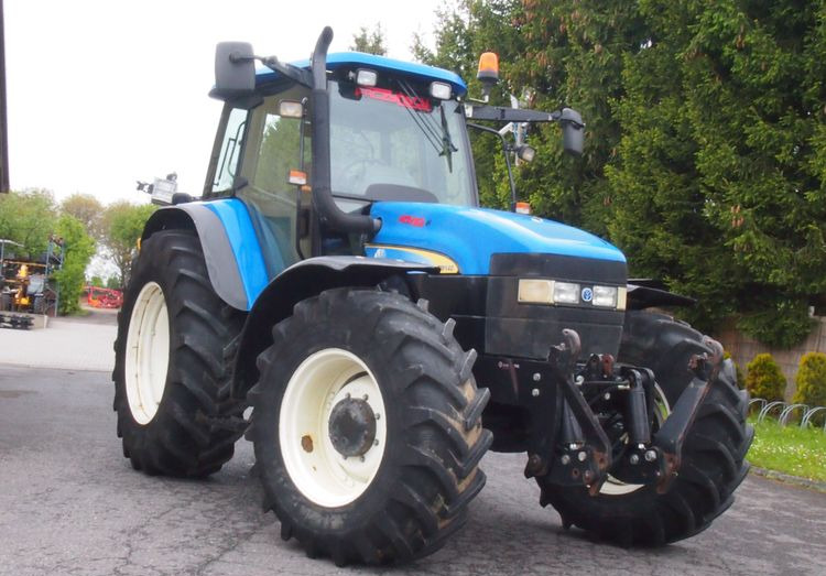 Ciągnik New Holland TM 140 2004 Przedni TUZ - Трактор: фото 2 Ciągnik New Holland TM 140 2004 Przedni TUZ - Трактор: фото 2
