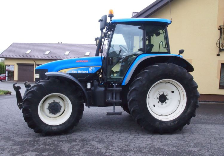 Ciągnik New Holland TM 140 2004 Przedni TUZ - Трактор: фото 5 Ciągnik New Holland TM 140 2004 Przedni TUZ - Трактор: фото 5
