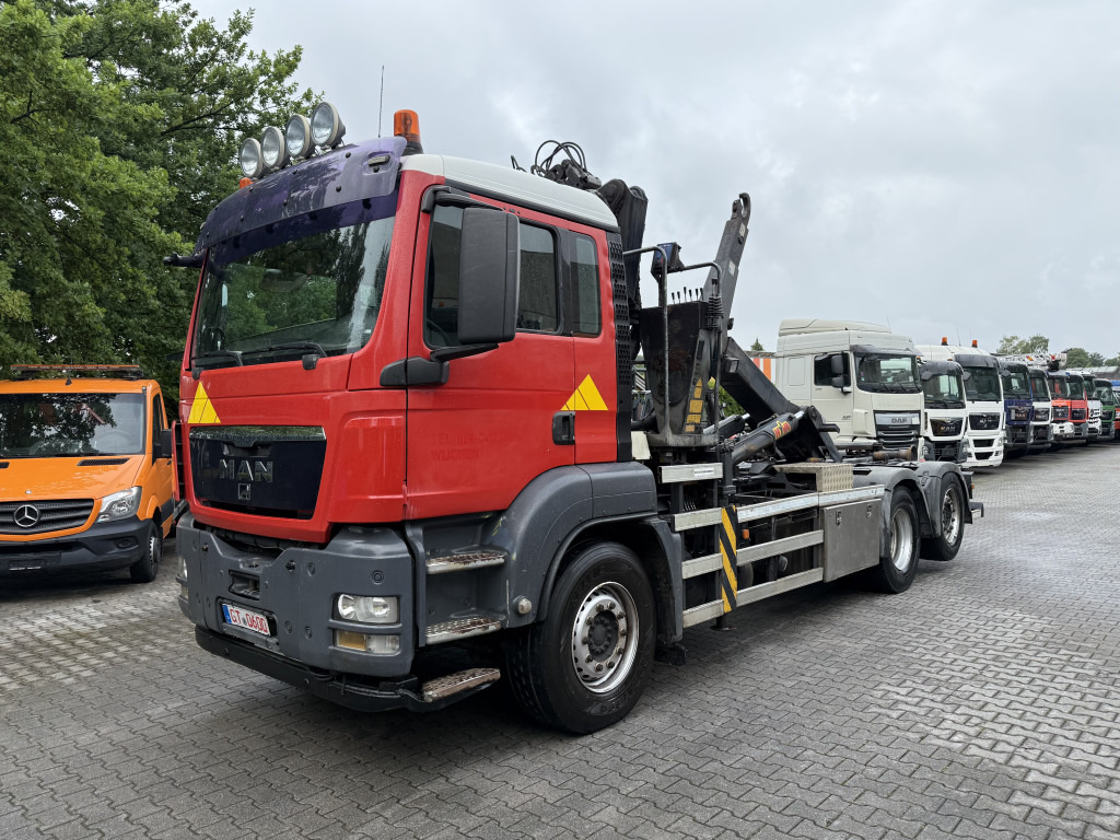 MAN TGS 26.360 6X2 Haken mit Kran HMF 1643Z - Гаковий мультиліфт вантажівка, Вантажівка з маніпулятором: фото 1 MAN TGS 26.360 6X2 Haken mit Kran HMF 1643Z - Гаковий мультиліфт вантажівка, Вантажівка з маніпулятором: фото 1