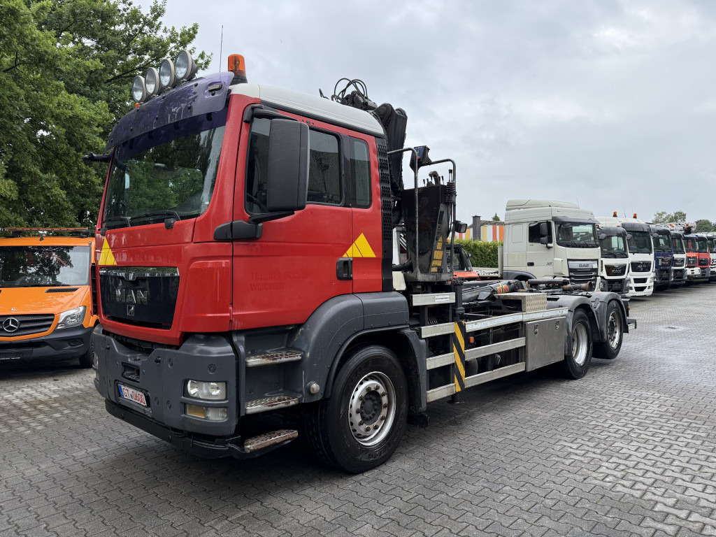 MAN TGS 26.360 6X2 Haken mit Kran HMF 1643Z - Гаковий мультиліфт вантажівка, Вантажівка з маніпулятором: фото 1 MAN TGS 26.360 6X2 Haken mit Kran HMF 1643Z - Гаковий мультиліфт вантажівка, Вантажівка з маніпулятором: фото 1