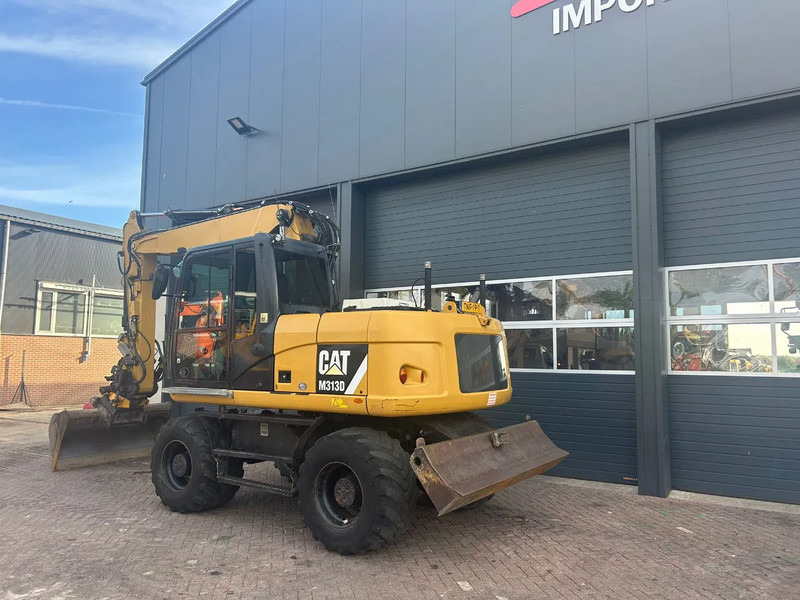 Caterpillar M313D - Колісний екскаватор: фото 2 Caterpillar M313D - Колісний екскаватор: фото 2