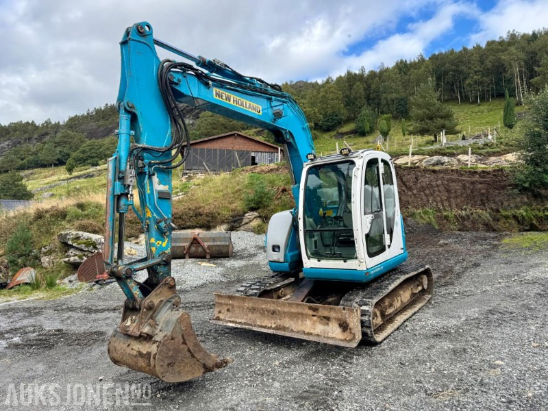 2008 New Holland E70SR-ES Gravemaskin - Tannskuffe - Grøfteskuffe - Pusseskuffe - Timer: 5746 - Міні-екскаватор: фото 1 2008 New Holland E70SR-ES Gravemaskin - Tannskuffe - Grøfteskuffe - Pusseskuffe - Timer: 5746 - Міні-екскаватор: фото 1