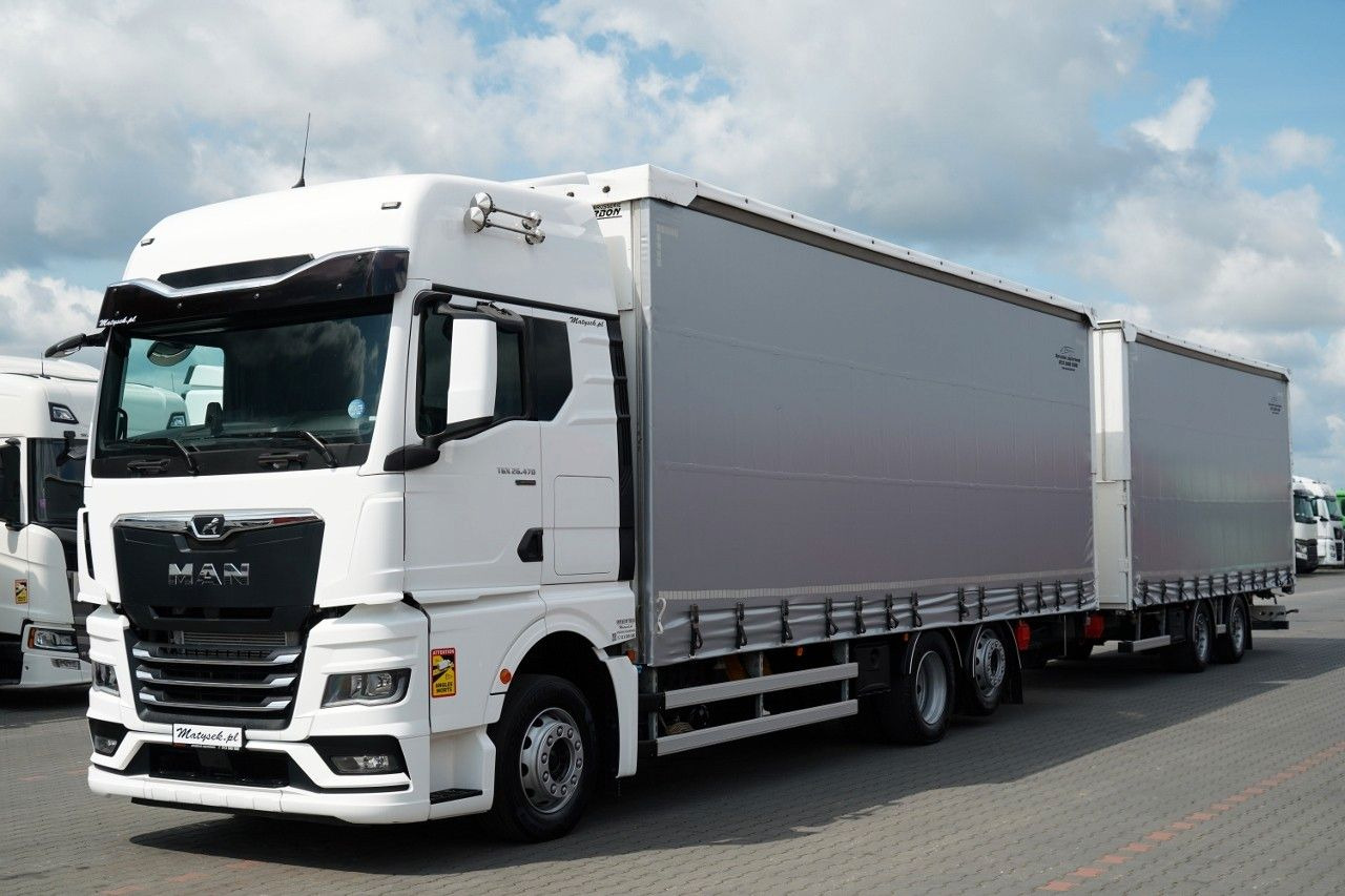 MAN TGX 26.470 / ZESTAW TANDEM 120 M3 / PRZEJAZDOWY - Тентована вантажівка: фото 1 MAN TGX 26.470 / ZESTAW TANDEM 120 M3 / PRZEJAZDOWY - Тентована вантажівка: фото 1