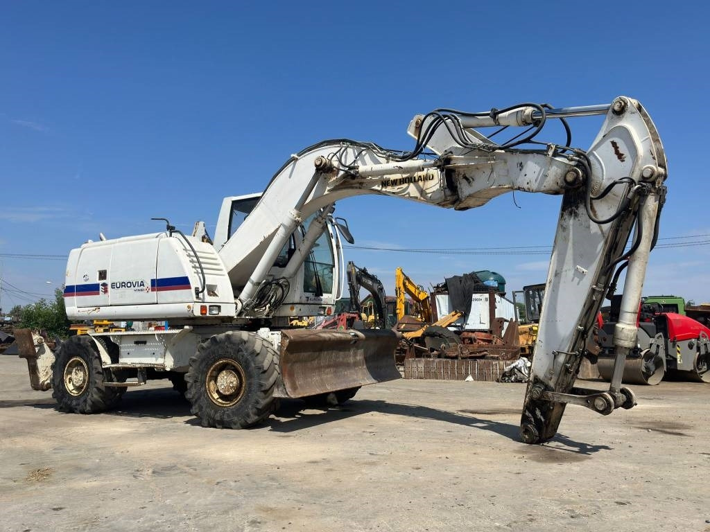 New Holland MH Plus - Колісний екскаватор: фото 1 New Holland MH Plus - Колісний екскаватор: фото 1