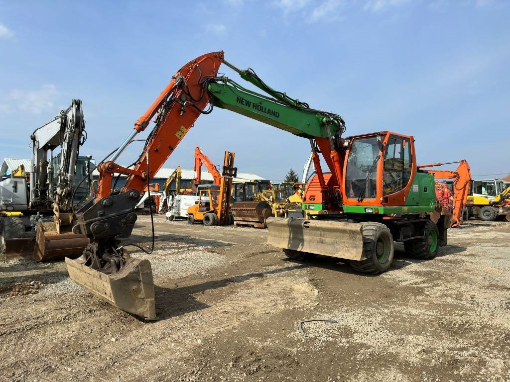 New Holland MH Plus - Колісний екскаватор: фото 1 New Holland MH Plus - Колісний екскаватор: фото 1