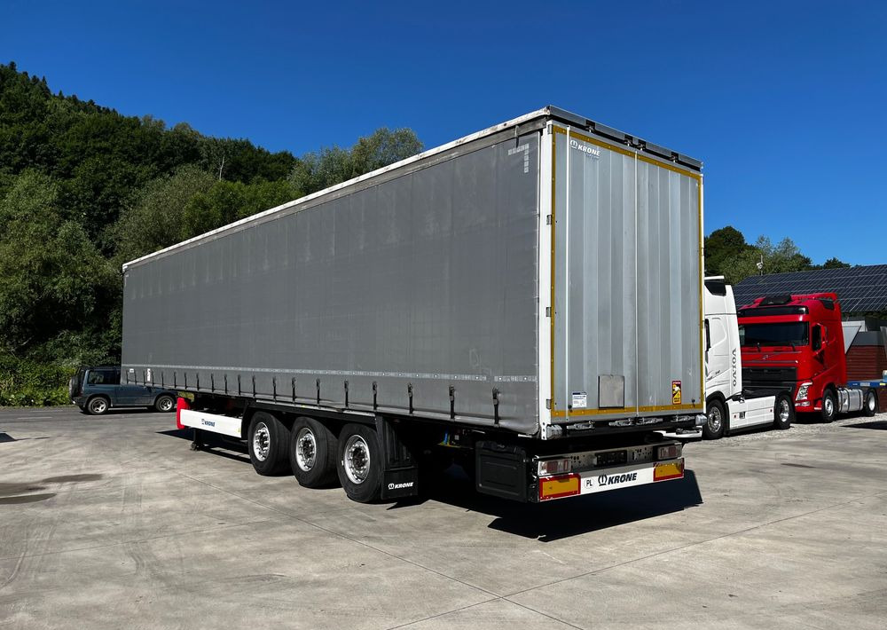 Krone Firanka Coilmulde // 9m // Alu Drzwi // Ażury // Oś podnoszona // - Тентований напівпричіп: фото 3 Krone Firanka Coilmulde // 9m // Alu Drzwi // Ażury // Oś podnoszona // - Тентований напівпричіп: фото 3
