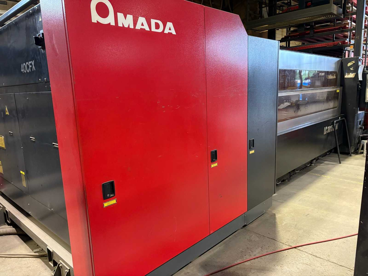 CNC Controlled CO2 Laser Cutting Machine Amada LC 3015 X1 NT - Металообробний верстат: фото 2 CNC Controlled CO2 Laser Cutting Machine Amada LC 3015 X1 NT - Металообробний верстат: фото 2