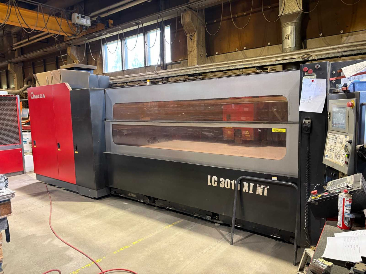 CNC Controlled CO2 Laser Cutting Machine Amada LC 3015 X1 NT - Металообробний верстат: фото 1 CNC Controlled CO2 Laser Cutting Machine Amada LC 3015 X1 NT - Металообробний верстат: фото 1