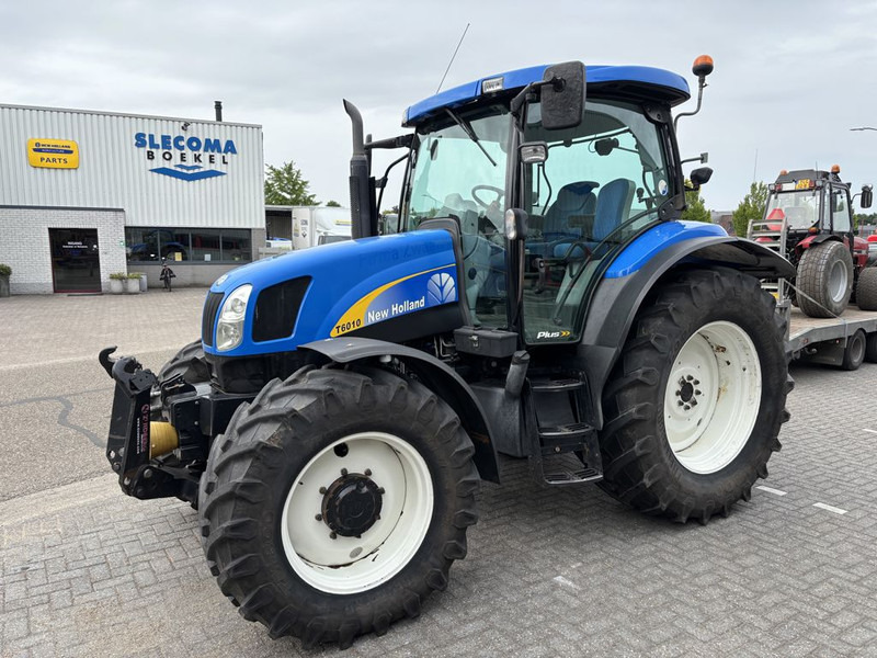 New Holland T6010 Plus Supersteer - Трактор: фото 1 New Holland T6010 Plus Supersteer - Трактор: фото 1