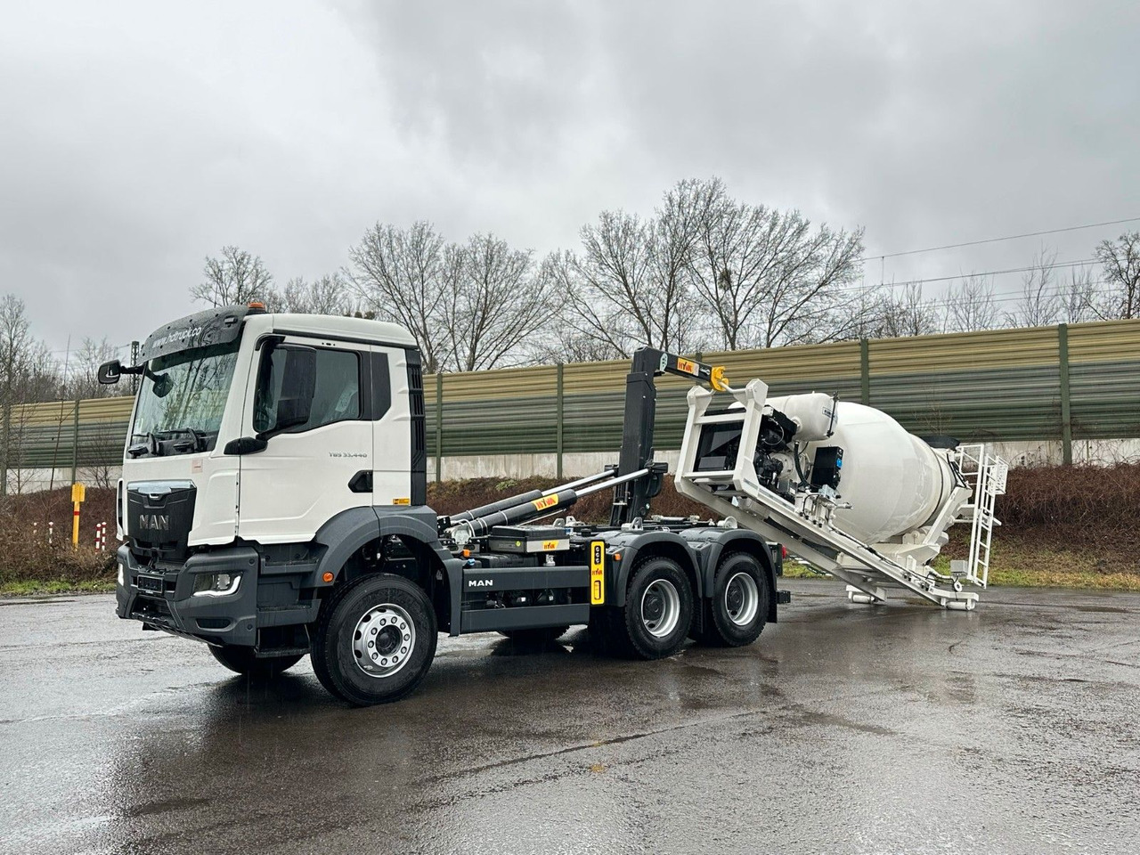 MAN TGS 33.440 6x4 Euro6e Abroller + Fahrmischer - Гаковий мультиліфт вантажівка, Вантажівка з маніпулятором: фото 1 MAN TGS 33.440 6x4 Euro6e Abroller + Fahrmischer - Гаковий мультиліфт вантажівка, Вантажівка з маніпулятором: фото 1