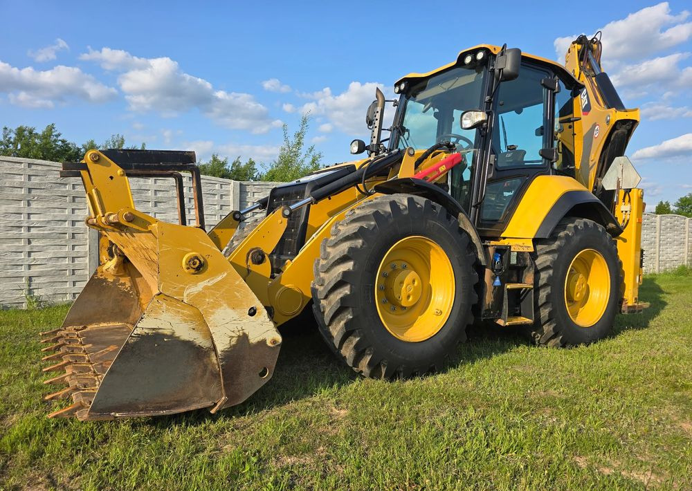 Caterpillar - Екскаватор-навантажувач: фото 1 Caterpillar - Екскаватор-навантажувач: фото 1