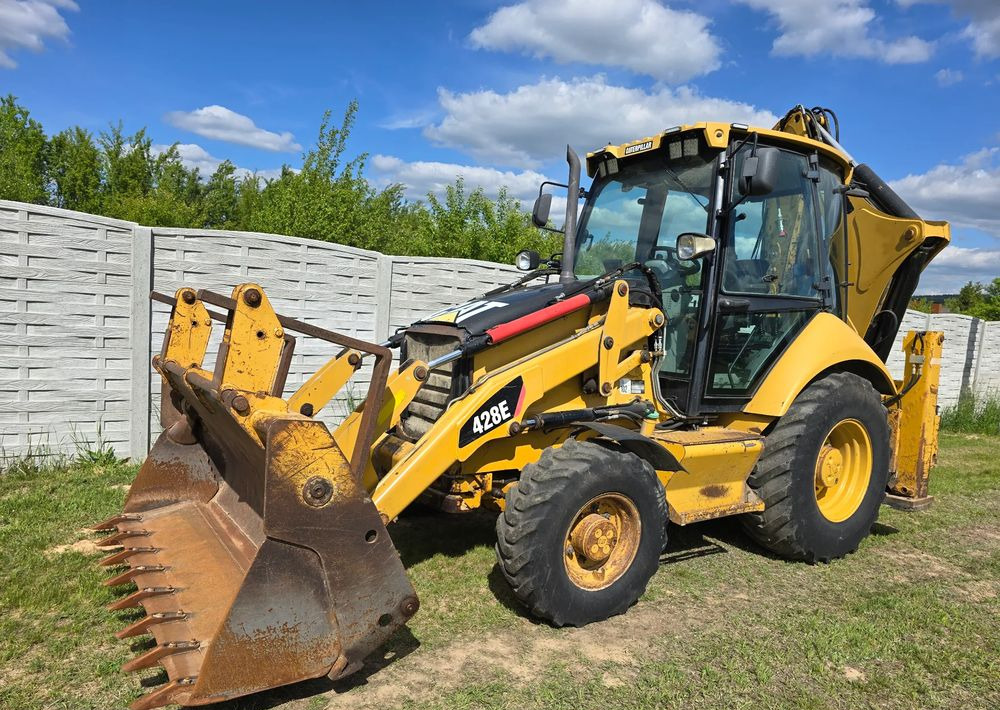 Caterpillar - Екскаватор-навантажувач: фото 1 Caterpillar - Екскаватор-навантажувач: фото 1