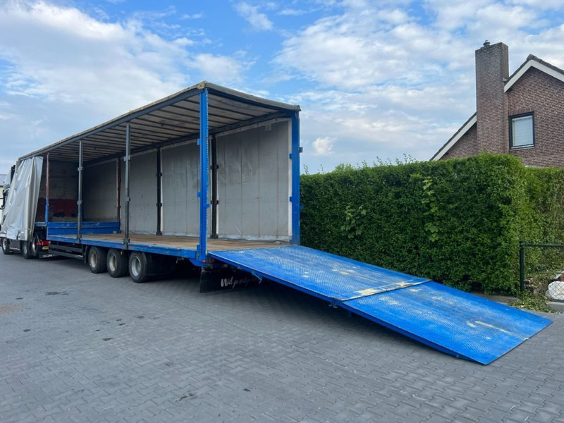 Kögel Semi dieplader met oprijklep - Низькорамна платформа напівпричіп: фото 1 Kögel Semi dieplader met oprijklep - Низькорамна платформа напівпричіп: фото 1