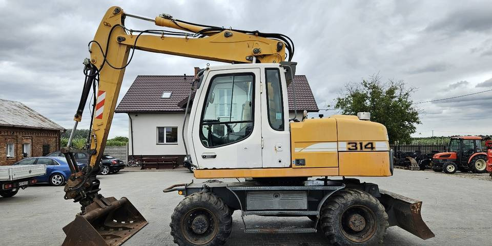 Koparka kołowa Liebherr A314 Litronic 9350 h 4 łyżki kołówka - Колісний екскаватор: фото 1 Koparka kołowa Liebherr A314 Litronic 9350 h 4 łyżki kołówka - Колісний екскаватор: фото 1