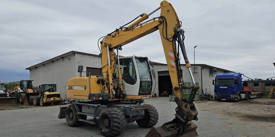 Koparka kołowa Liebherr A314 Litronic 9350 h 4 łyżki kołówka - Колісний екскаватор: фото 4 Koparka kołowa Liebherr A314 Litronic 9350 h 4 łyżki kołówka - Колісний екскаватор: фото 4