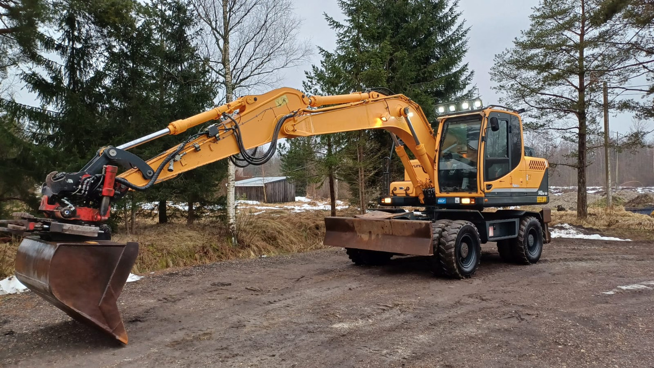 Hyundai Robex 140W-9A - Колісний екскаватор: фото 1 Hyundai Robex 140W-9A - Колісний екскаватор: фото 1