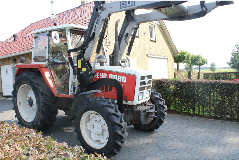 Steyr 8080 met voorlader 40 kmh - Трактор: фото 1 Steyr 8080 met voorlader 40 kmh - Трактор: фото 1