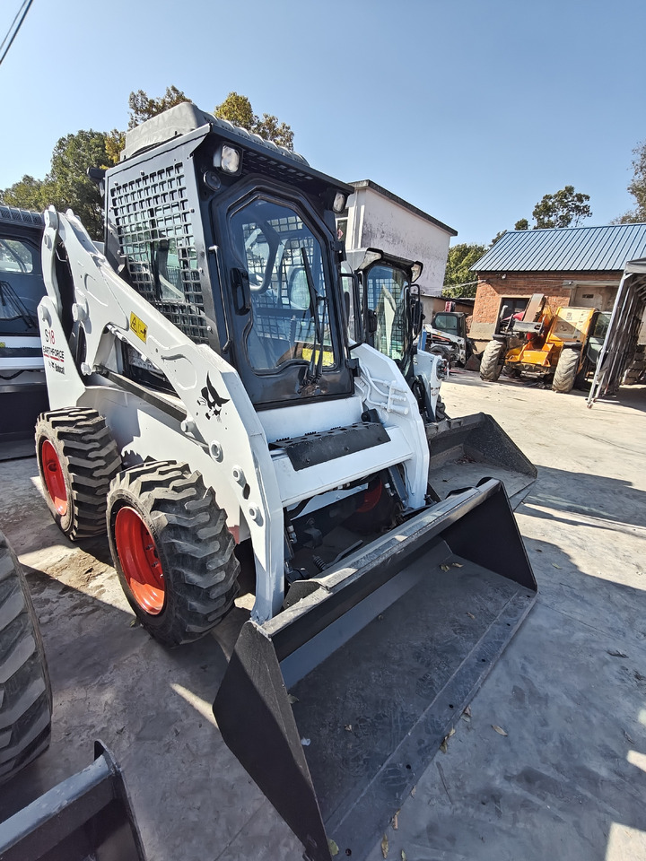 BOBCAT S18 Skid Steer Loader Click for Disconunt - Міні-навантажувач: фото 1 BOBCAT S18 Skid Steer Loader Click for Disconunt - Міні-навантажувач: фото 1
