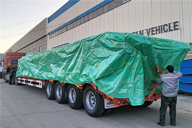 TITAN 4 Axle 100 Ton Low Bed Truck Trailer for Sale In Zambia - Низькорамна платформа напівпричіп: фото 4 TITAN 4 Axle 100 Ton Low Bed Truck Trailer for Sale In Zambia - Низькорамна платформа напівпричіп: фото 4