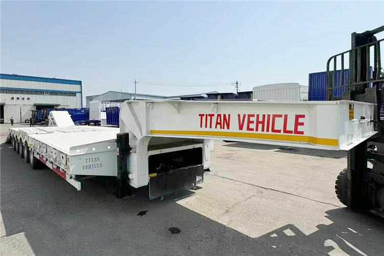 TITAN 5 Axle 100 Ton Low Bed Trailer for Sale In Tanzania - Низькорамна платформа напівпричіп: фото 5 TITAN 5 Axle 100 Ton Low Bed Trailer for Sale In Tanzania - Низькорамна платформа напівпричіп: фото 5